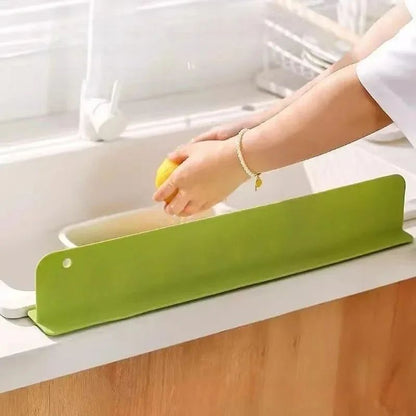 Silicone sink splash guard from fusiongadgetspk, flexible and waterproof, designed to prevent water splashes around the sink area.